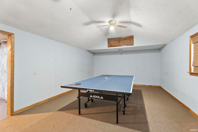 game room with a textured ceiling, ceiling fan, carpet, and lofted ceiling