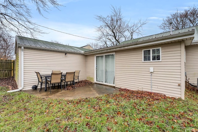 back of property featuring a patio