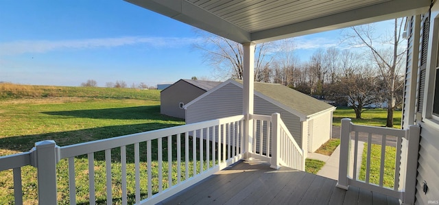 wooden deck featuring a yard