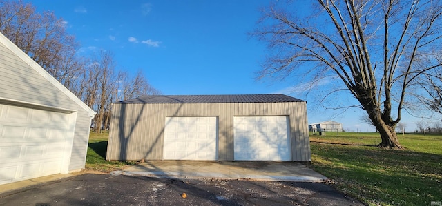 garage featuring a yard