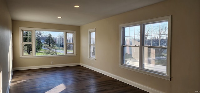 empty room featuring dark wood-type flooring