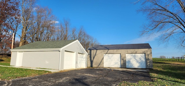 garage featuring a lawn