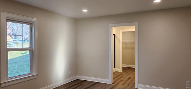 empty room with hardwood / wood-style floors