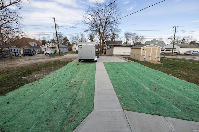 view of yard with a storage shed