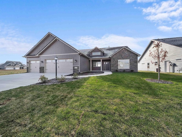 view of front facade with a front yard and a garage