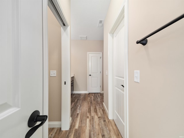 corridor featuring light hardwood / wood-style flooring