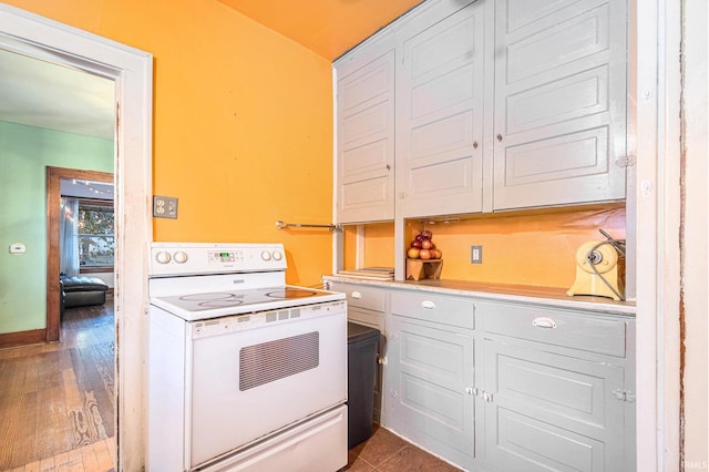 kitchen with white cabinets, white range with electric stovetop, and light wood-type flooring