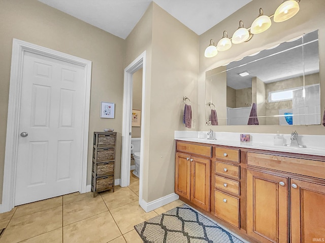 bathroom with walk in shower, tile patterned flooring, vanity, and toilet