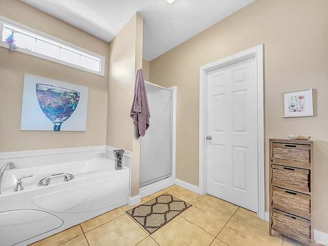 bathroom with tile patterned flooring and plus walk in shower