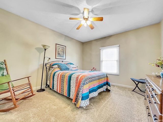 bedroom with light carpet and ceiling fan