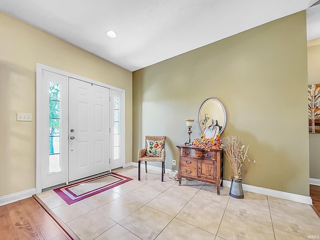 entrance foyer with light hardwood / wood-style flooring