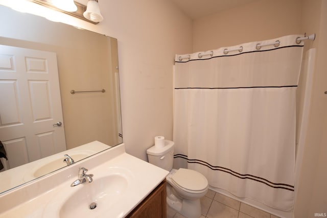 bathroom featuring toilet, vanity, tile patterned flooring, and curtained shower