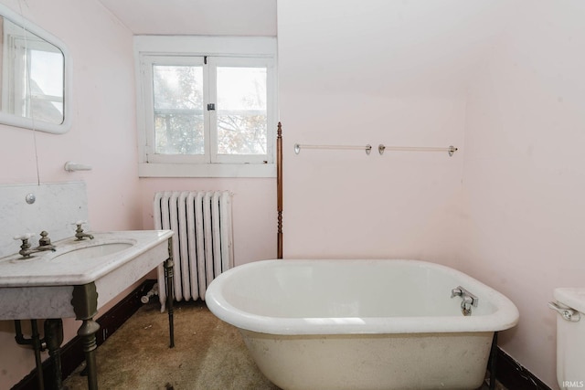 bathroom featuring radiator and a bathing tub