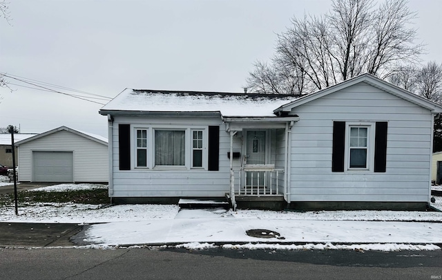 view of front facade featuring an outbuilding and a garage