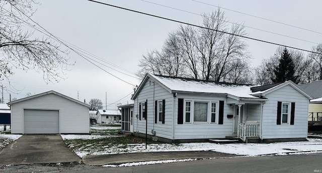 view of front of house with a garage and an outdoor structure