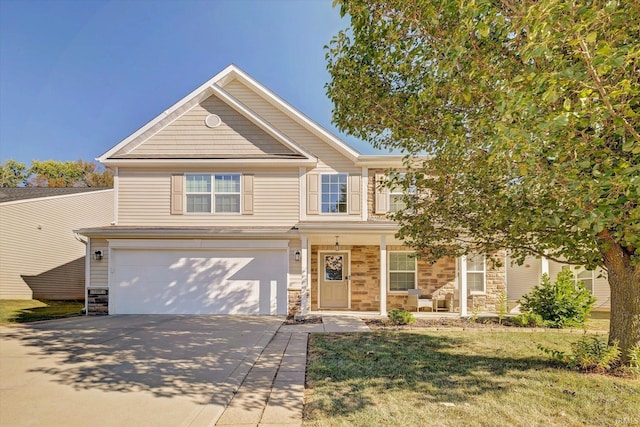 view of front of house featuring a front lawn, a porch, and a garage