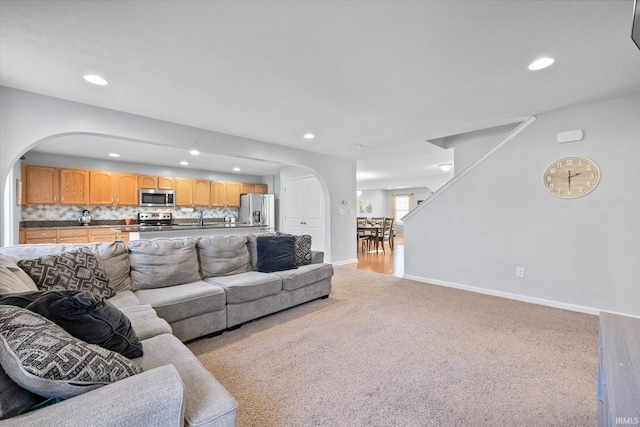 living room featuring light colored carpet