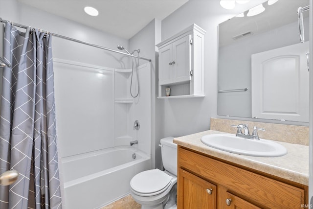 full bathroom featuring vanity, toilet, and shower / tub combo