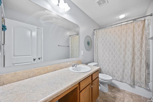 full bathroom with vanity, toilet, and shower / bath combo with shower curtain