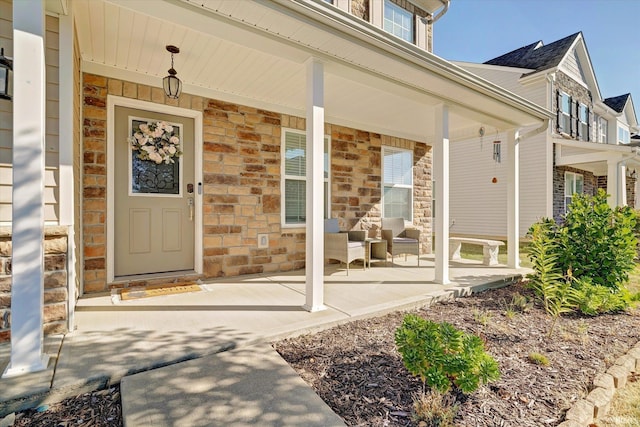 doorway to property with covered porch