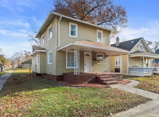 view of front facade featuring covered porch and a front lawn