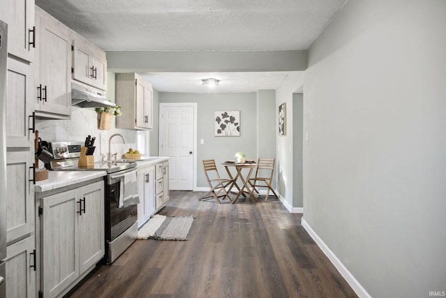 kitchen featuring white cabinetry, sink, dark wood-type flooring, and stainless steel electric range