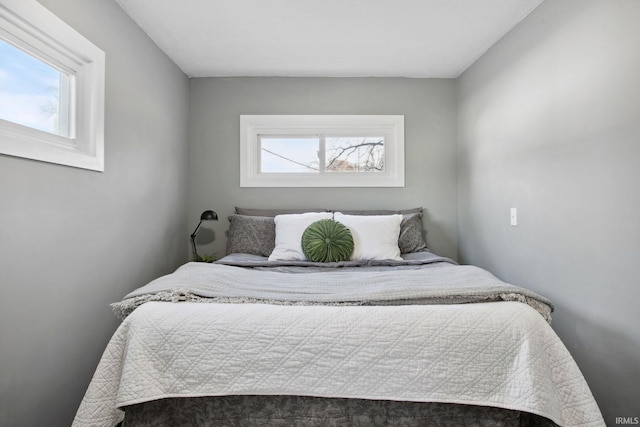 bedroom featuring multiple windows