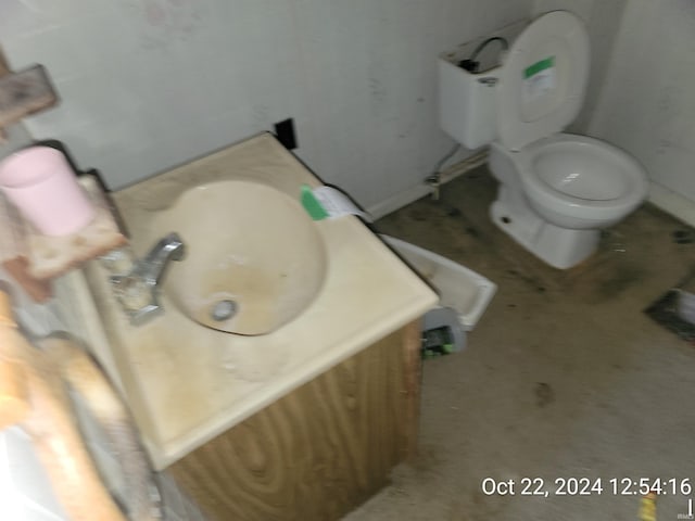 bathroom featuring vanity and toilet