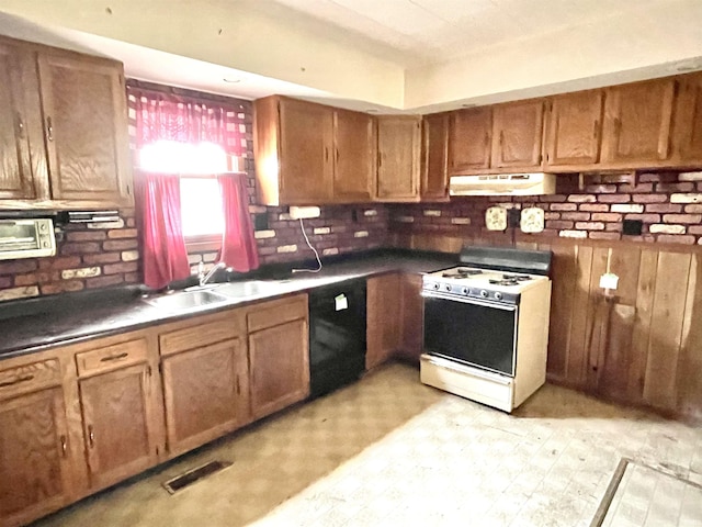 kitchen featuring sink, white range with gas stovetop, and black dishwasher