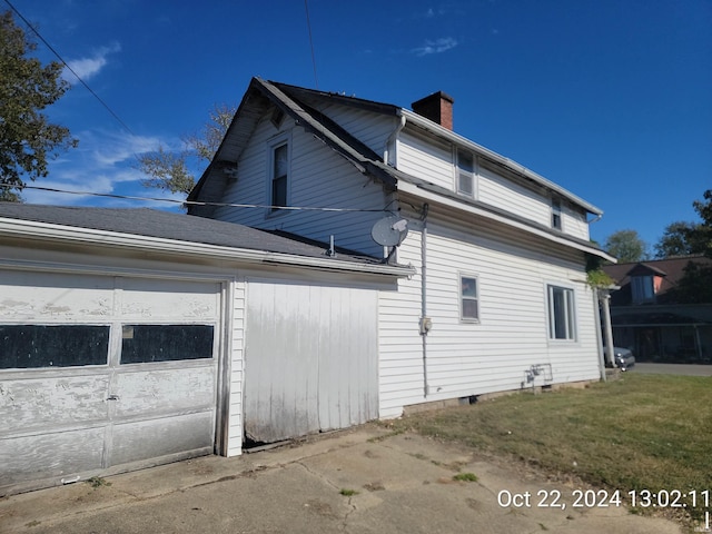 view of property exterior with a garage