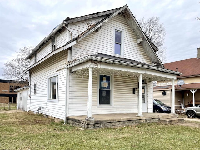 view of front of property with a front lawn and covered porch