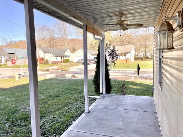 view of patio with ceiling fan and a porch