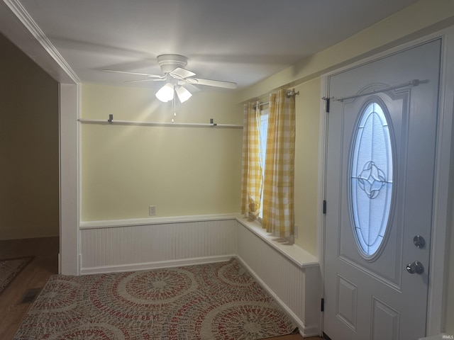 entryway with ceiling fan and wood-type flooring