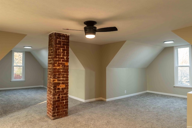 bonus room featuring light colored carpet, vaulted ceiling, and ceiling fan