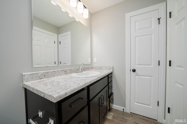 bathroom featuring vanity and wood-type flooring