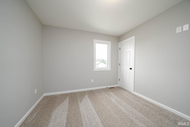 empty room with carpet flooring