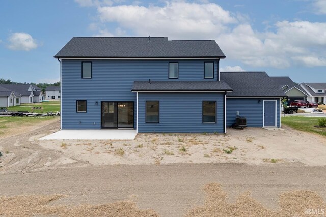 back of house with a patio