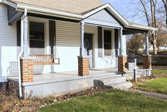 property entrance with covered porch