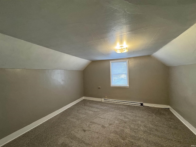 additional living space with carpet flooring, lofted ceiling, and a baseboard heating unit