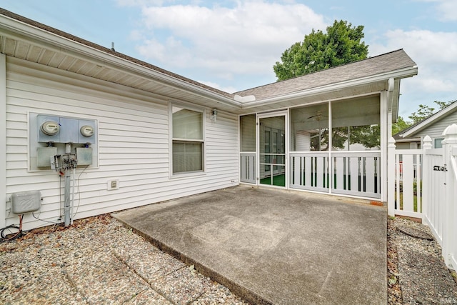 view of patio / terrace featuring a sunroom