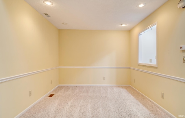 unfurnished room with carpet floors