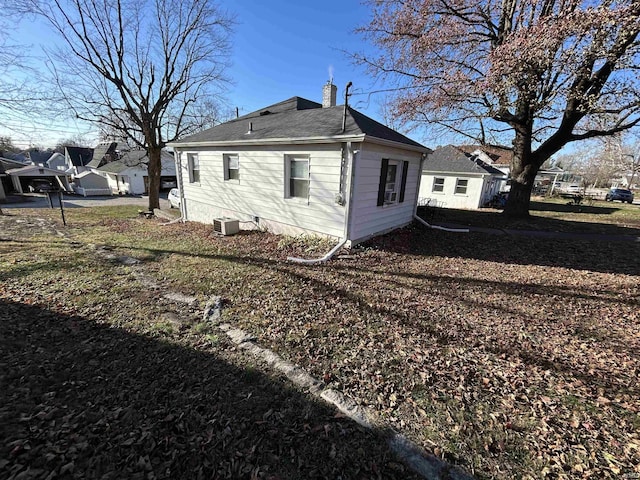 view of home's exterior with cooling unit