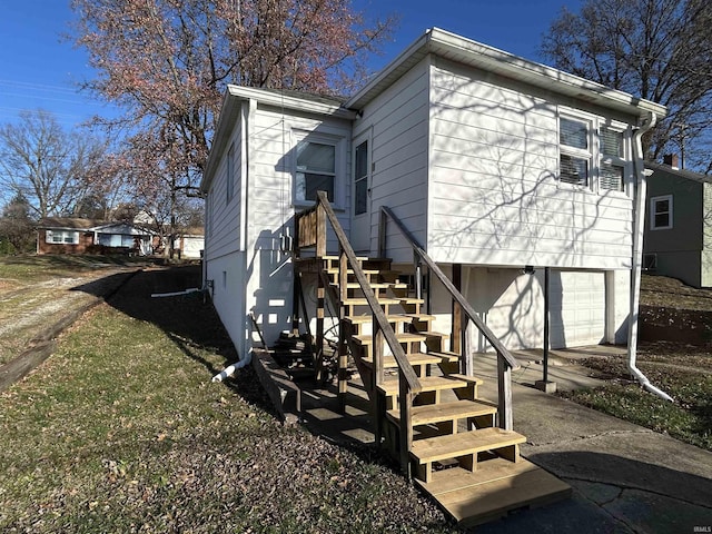 rear view of house with a garage