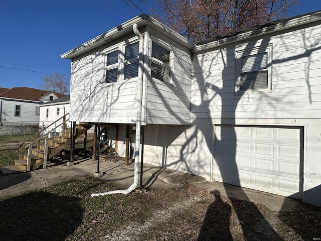 view of property exterior featuring a garage