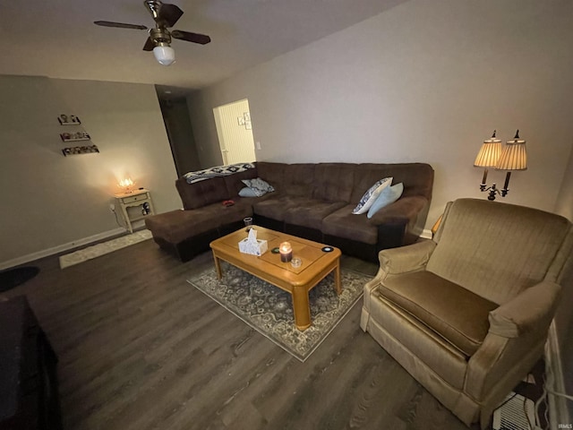 living room featuring ceiling fan and dark hardwood / wood-style floors