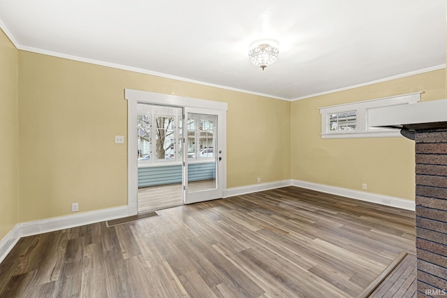 unfurnished living room with hardwood / wood-style floors and ornamental molding