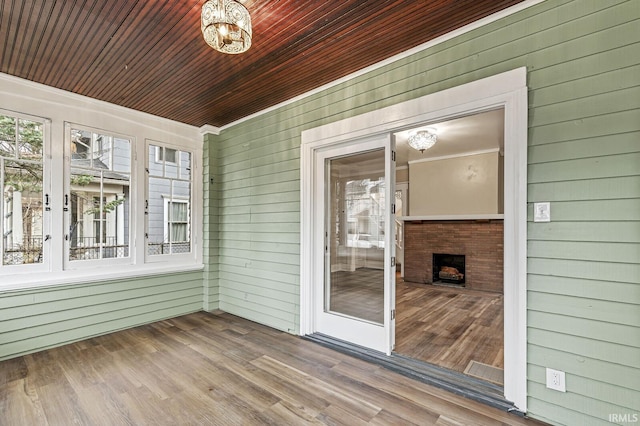 unfurnished sunroom featuring wooden ceiling