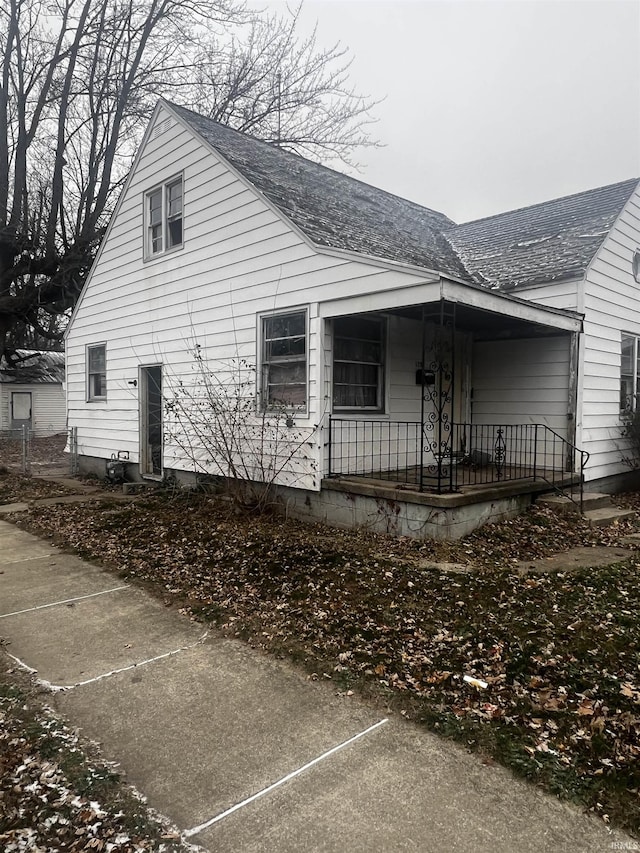 view of side of property with a porch