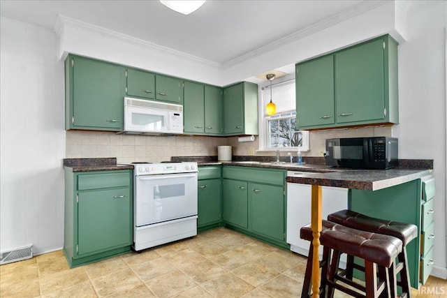 kitchen featuring green cabinets, white appliances, ornamental molding, and tasteful backsplash