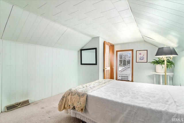 bedroom with carpet and lofted ceiling